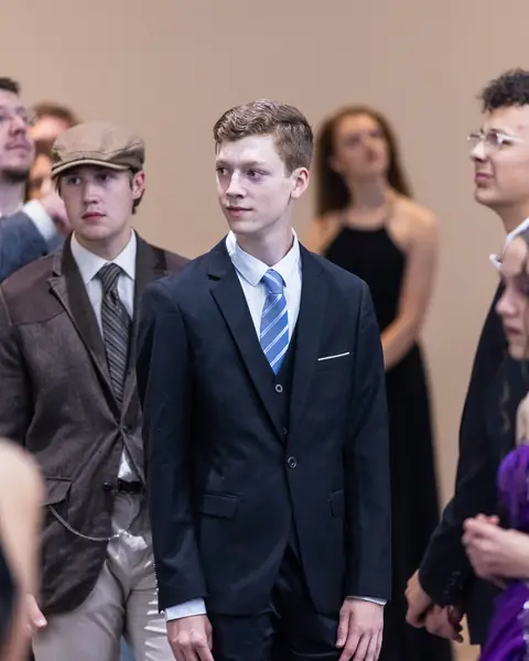 Gentlemen in suits between dances